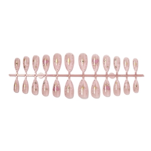 Pink almond French press-on nails with gold star patterns and sparkling rhinestone accents
