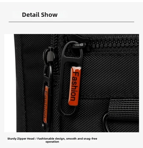 Detailed macro view of smooth black zipper with fashion orange puller on commute bag