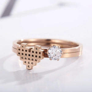 Macro shot of rose gold heart ring featuring a centered round cubic zirconia crystal