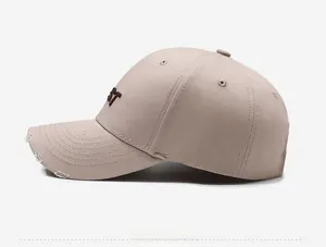 Side view of khaki vintage baseball cap showing side embroidery and distressed brim detail