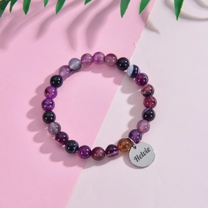 Custom engraved stainless steel bracelet with purple natural stone beads and round pendant