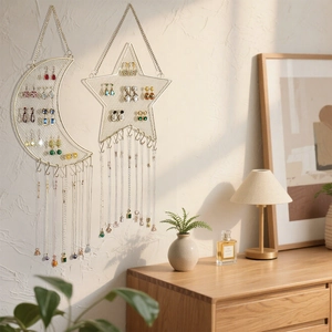 Star and moon shaped gold metal mesh wall jewelry organizer for earrings and necklaces