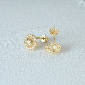 Detailed close-up of 925 sterling silver hallmarked stud with pavé cubic zirconia