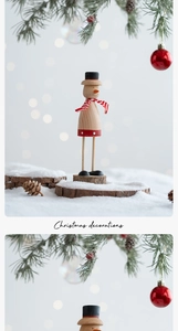 Detail of wooden snowman ornament with red and white paint for Christmas tree decor