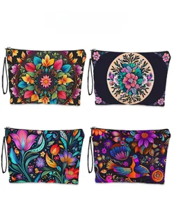 Detailed pattern display of four Day of the Dead floral makeup bags with wrist straps