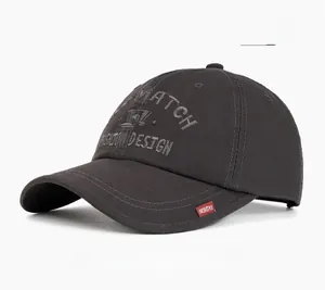 Detailed embroidery of MATCH FASHION DESIGN text on gray cotton baseball cap