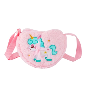 Detail of pink heart-shaped plush crossbody bag with unicorn embroidery and woven strap