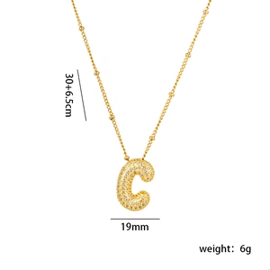 Detail of 18K gold plated letter C pendant with micro-pave cubic zirconia and bead chain