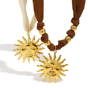 Luxurious 18K gold plated stainless steel sun pendant necklace on silk cord strand