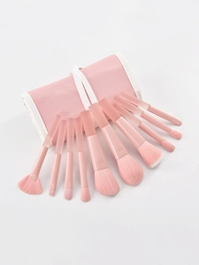 Detailed view of 9 peach pink makeup brushes with a matching PU leather storage case