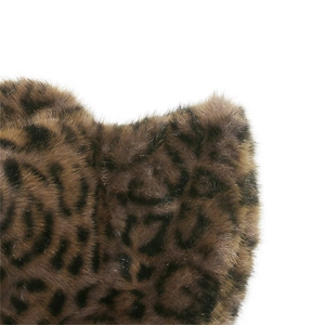 Detail shot of plush faux fur texture with brown and black leopard print pattern