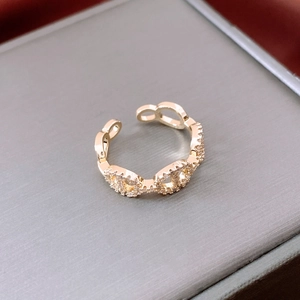 Macro shot of 14K gold plated pig nose ring with micro-pave cubic zirconia settings