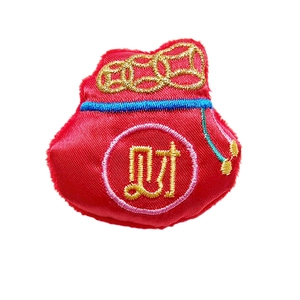 Traditional red Chinese New Year fortune bag with gold embroidery and silk texture