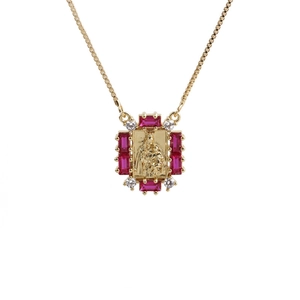 Gold necklace with square pendant featuring relief figure and red rectangular gemstones