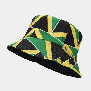 Detailed view of canvas bucket hat featuring green yellow and black geometric patterns