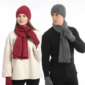 Winter knitted warm set with a thick beanie scarf and touchscreen gloves for outdoors