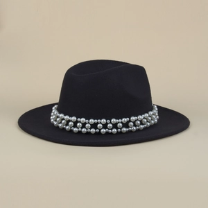 Close-up of elegant wide brim fedora hat featuring a double-row pearl decorative band