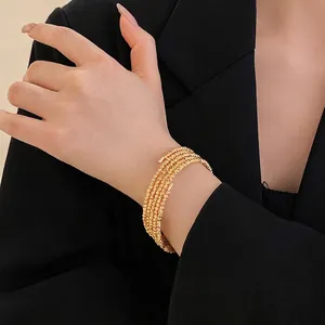Elegant multi-layer gold plated beaded wrap bracelet with minimalist open design
