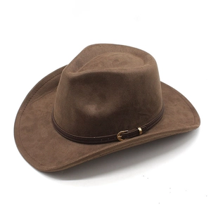 Close-up of brown suede cowboy hat featuring a leather band with a gold metal buckle