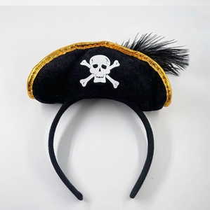 Detail of a pirate headband featuring a skull and crossbones print with a black feather