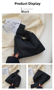 Macro view of a black rhinestone knot bag with sparkling beaded texture for evening fashion