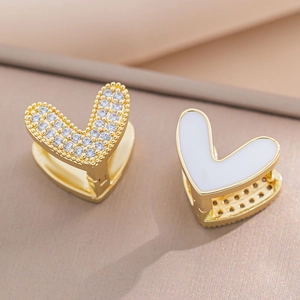 Elegant gold double-sided heart hoop earrings with white enamel and sparkling cubic zirconia