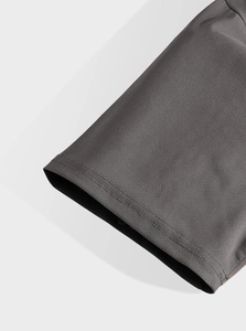 Detail of twin-needle stitching and charcoal grey knit fabric on men's t-shirt sleeve
