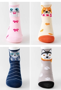 Detail view of pink cat and beige corgi cartoon pattern knitted socks for women