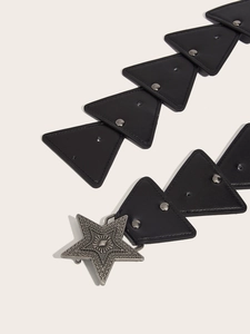 Detail of black PU leather belt with triangular panels and star buckle closure