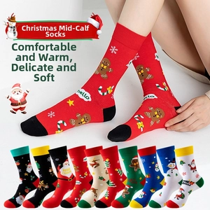 Close-up of festive cotton crew socks with gingerbread and reindeer holiday patterns