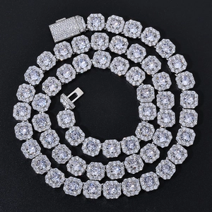 Silver square link chain necklace with shiny cubic zirconia and box clasp on black backdrop