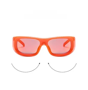 Detail view of retro square orange frame sunglasses with translucent pink tinted lenses