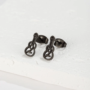 Matte black stainless steel guitar silhouette stud earrings on white stone surface