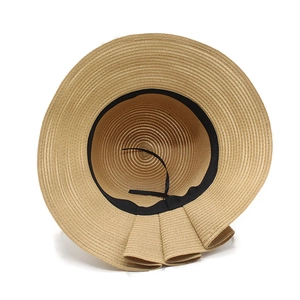Elegant summer straw sun hat for women with a wide ruffled brim and bow in khaki finish