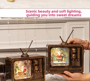 Macro shot of retro TV Christmas music box with Santa Claus and festive warm lighting
