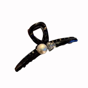 Elegant black hair claw clip with heart rhinestone and pearl on white background