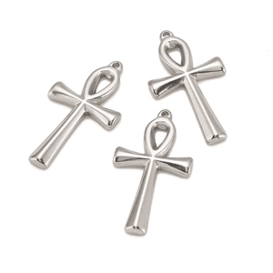 Macro detail of three polished silver metal Ankh cross pendants for DIY jewelry