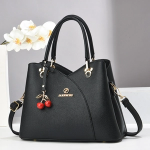 Classic black lychee texture handbag for women with elegant red cherry charm decoration