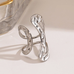 Irregular silver hammered stainless steel ring with modern organic textured finish