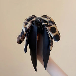 Leopard print and black satin bow hair claw clip with sparkling rhinestone center