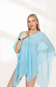 Light blue translucent silk-like shawl elegantly draped over a model's shoulders