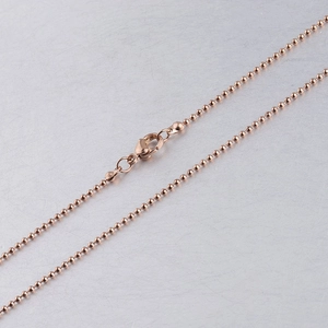 Detail shot of rose gold stainless steel bead chain with secure lobster clasp fastening