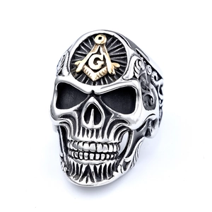 Close-up of gothic skull ring with golden Freemasonry symbol and detailed carvings