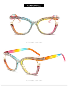 Detailed view of cat-eye frames with rainbow gold gradient, rhinestones and pearls