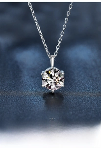 Macro shot of 925 sterling silver six-prong moissanite pendant with brilliant sparkle