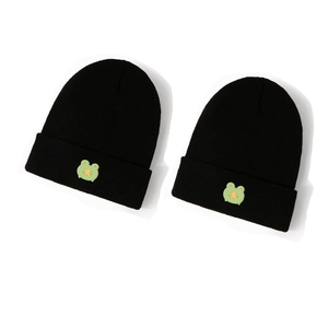 Set of two black knitted beanies featuring cute green cartoon frog and star embroidery