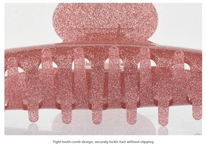 Detail of pink glitter hair claw clip showing dense teeth design for a secure non-slip hold