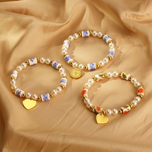 Bracelet Perlé Vintage Acier Inoxydable Künstliche Perle Imitation Résine Céramique Pendentif Coeur Pièce Style Bohème Femme