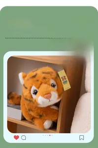 Realistic plush tiger toy detail showing soft orange fur and simulated bird sound feature