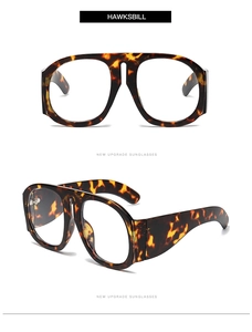 Detail of oversized hawksbill pattern eyeglass frames with thick temples and nose pads
